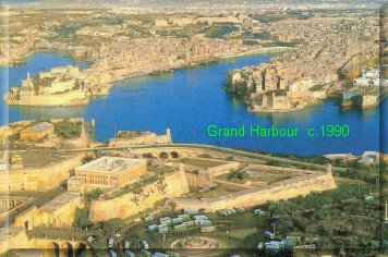 Grand Harbour c.1990. Aerial photo taken from above Valetta and looking across to the townships of Vittoriosa  & Cospicua. Much has changed since 1948, but Castel St. Angelo still stands out (left headland) as it has since the 10th century.
