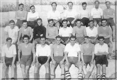 Forth' and 'Liverpool' Band Soccer teams, Manoel Island, Malta c.1950 - Light shirts Liverpool, Dark shirts Forth. I can only name our team with any confidence. Can anyone help with the un-named light shirts? Dk. Shirts Front row l-r. Knocker Paine, Ted Stigwood, Jimmy Dowling, Centre row. Whacker Paine, Ian Quarterly, Ron DeLorey, Self, 'Rattler Morgan, Back row. 'Jock' Dyer, Alf Alltimes, 'Taff' Lewis. In light shirts, 2nd from left in the back row is 'Polly' Hopkins, then  B.mster of Liverpool. Also middle row, 2nd from right was 'Farmer' Gleed. Modesty forbids mention of which team (wearing the dark shirts) won, but  the score was 5-2