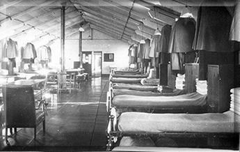 Burford Barrack room! (A U.S. Hospital Ward in an earlier incarnation) Note the old-fashioned stoves. By adding tins of Brasso (usually someone else's) to the fires, competitions were held to see how far up the metal chimney we could turn it red hot!